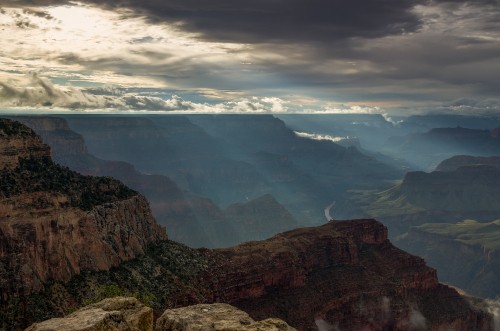 Image brown rocky mountain under white clouds during daytime