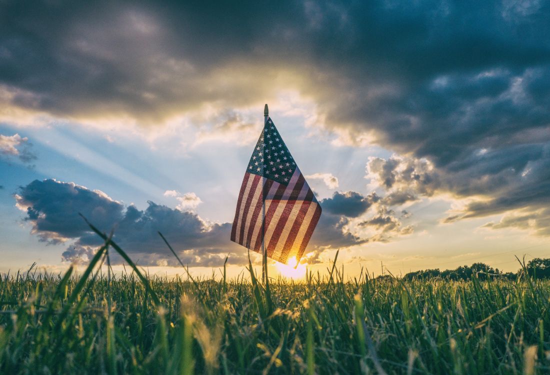us a Flag on Green Grass Field Under Cloudy Sky During Daytime. Wallpaper in 4479x3053 Resolution