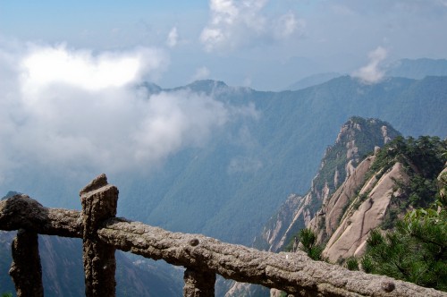 Image brown wooden fence on top of mountain during daytime