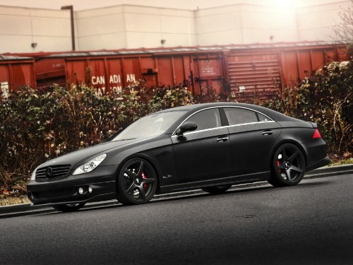 Image black porsche 911 parked on road during daytime