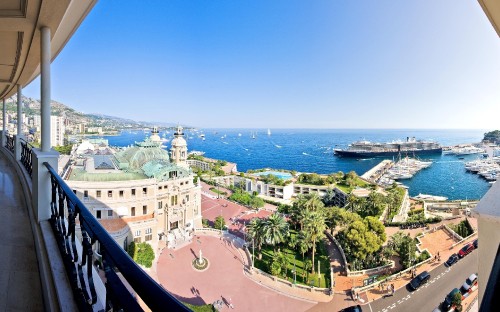 Image aerial view of city buildings near sea during daytime