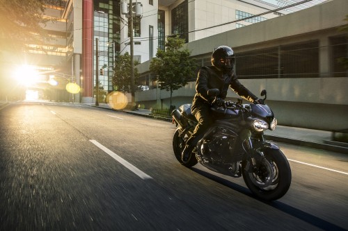 Image man in black motorcycle helmet riding motorcycle on road during daytime