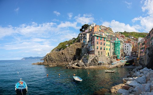 Image white boat on sea near concrete buildings under blue sky during daytime