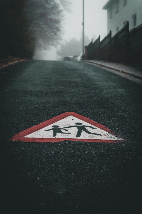 Image black white and red arrow sign on road