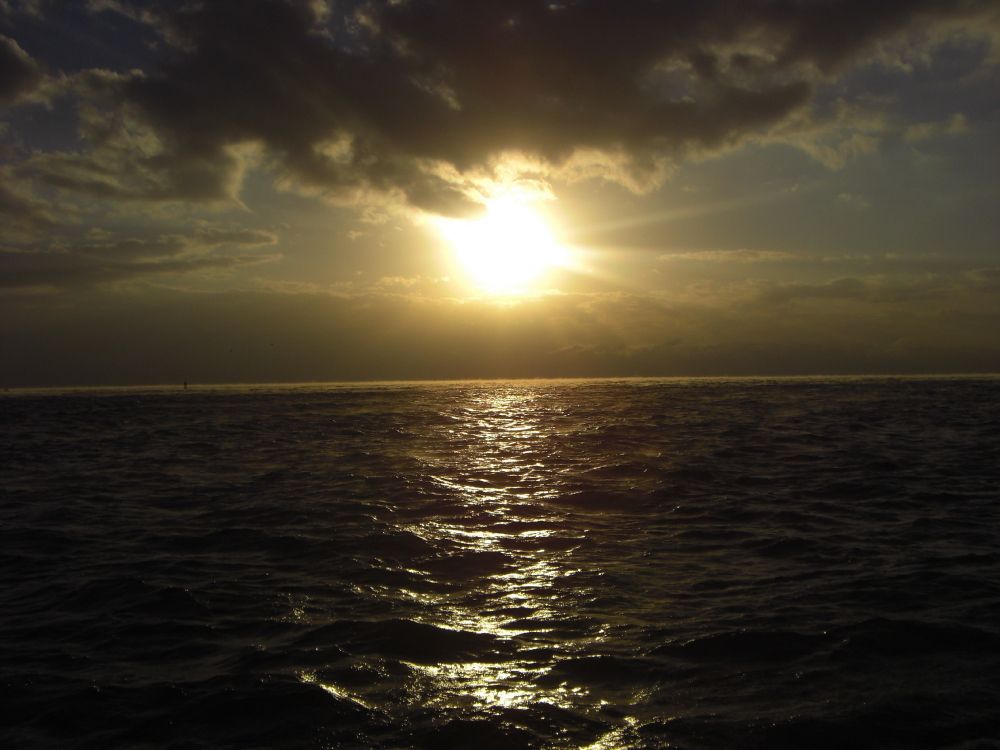 body of water under blue sky during daytime