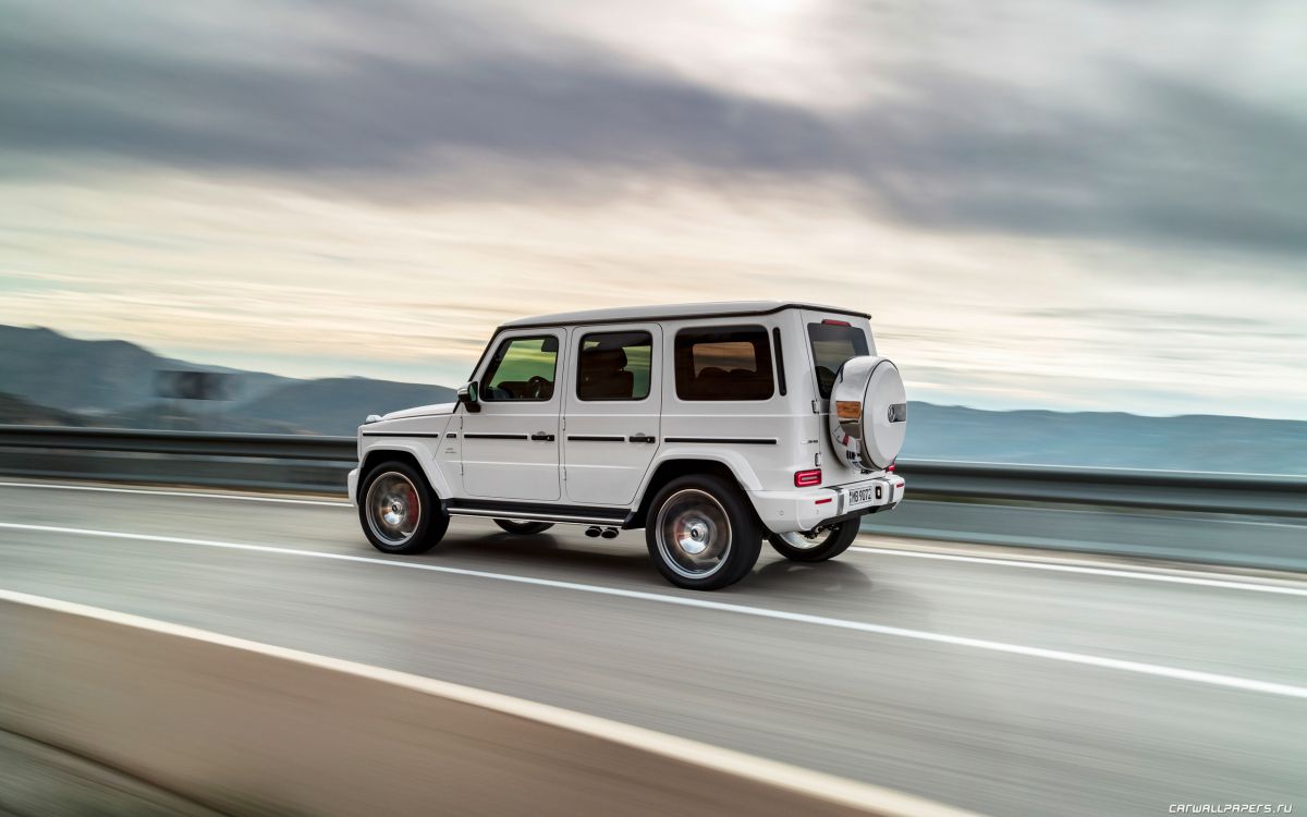 White Suv on Gray Asphalt Road During Daytime. Wallpaper in 2560x1600 Resolution