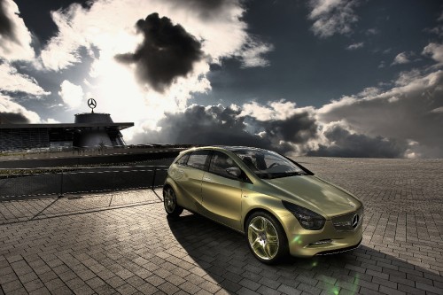 Image grayscale photo of sedan on brick pavement