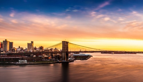 Image bridge over water during sunset