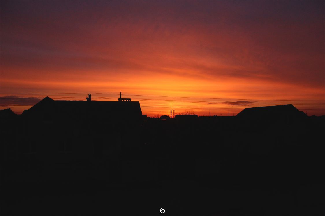 silhouette of building during sunset