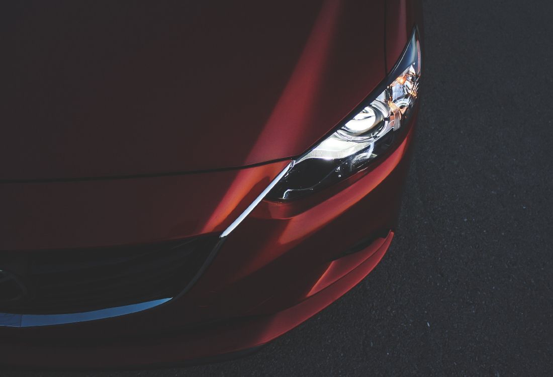 red car with white and blue light