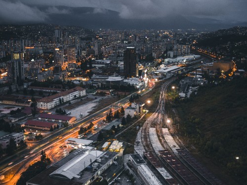 Image city with high rise buildings during night time