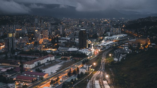 Image city with high rise buildings during night time