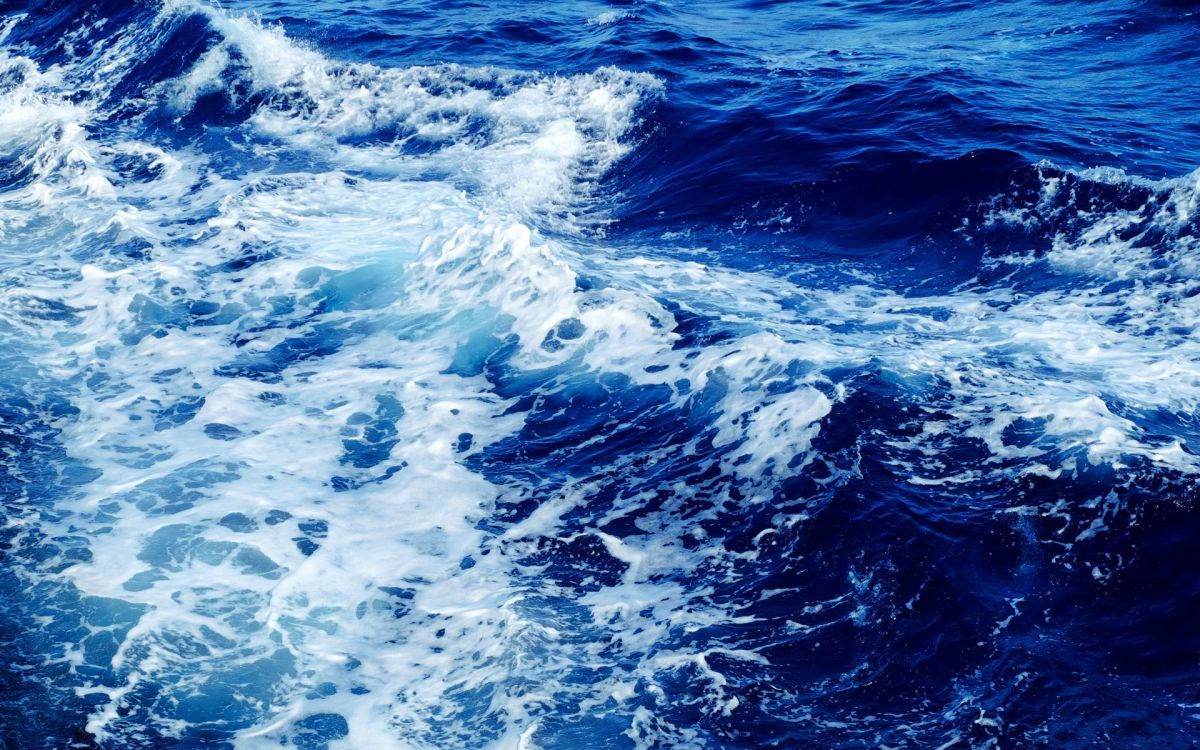 water waves on blue ocean water during daytime