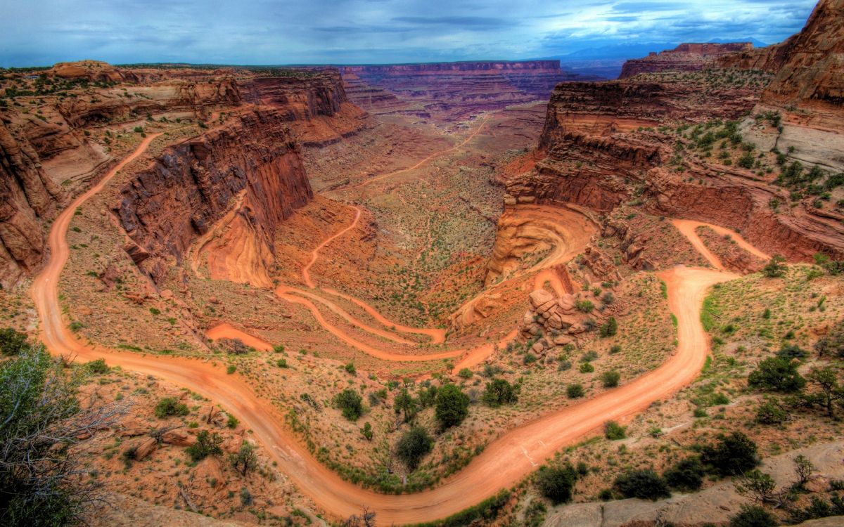 aerial view of road between brown mountains