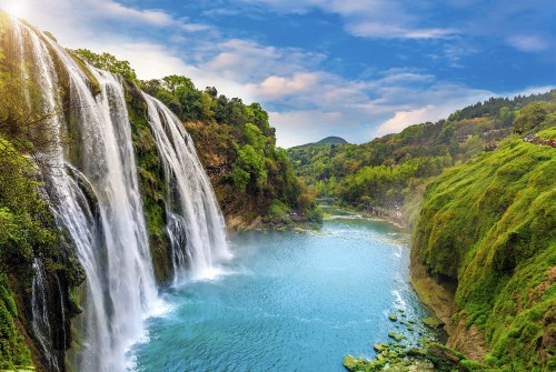 Image waterfalls on green grass covered mountain during daytime