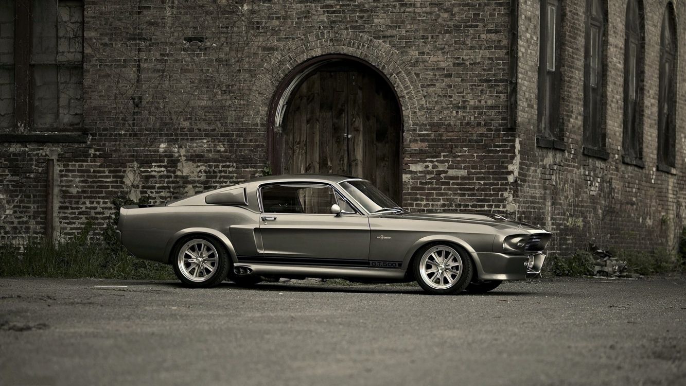 Grayscale Photo of Coupe Parked Beside Brick Wall. Wallpaper in 3840x2160 Resolution