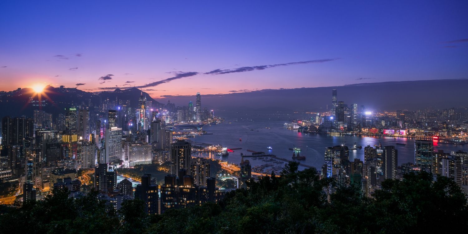 City Skyline Near Body of Water During Night Time. Wallpaper in 3000x1500 Resolution