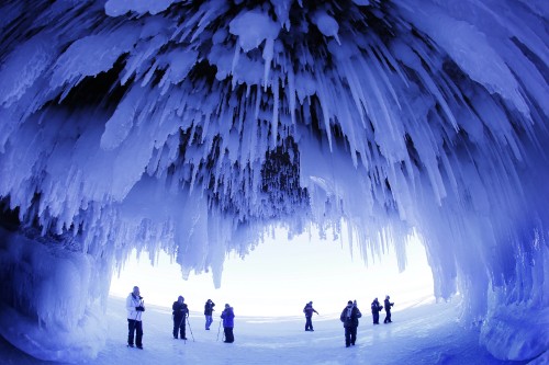 Image silhouette of people walking on snow covered ground