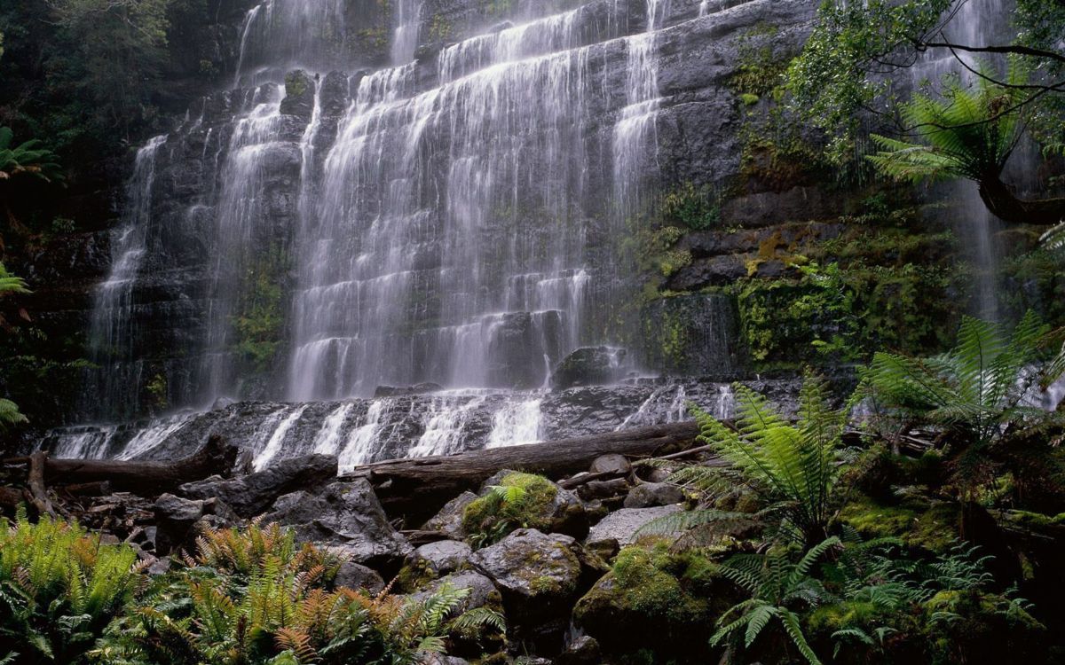 waterfalls in the middle of rocks