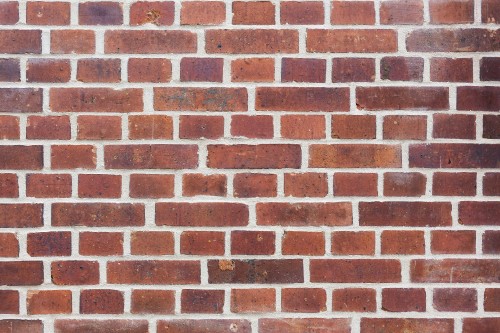 Image brown and black brick wall