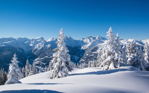 Image snow covered mountain under blue sky during daytime