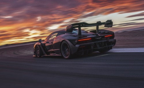 Image black porsche 911 on road during sunset