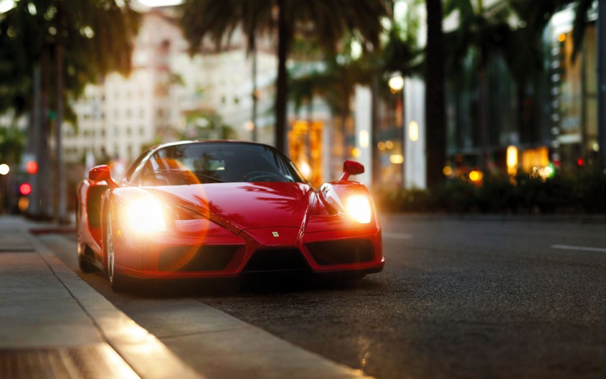 Red Ferrari Sports Car on Road During Daytime. Wallpaper in 3840x2400 Resolution