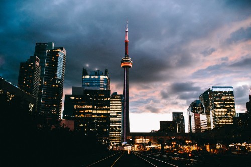 Image city skyline under gray cloudy sky during daytime