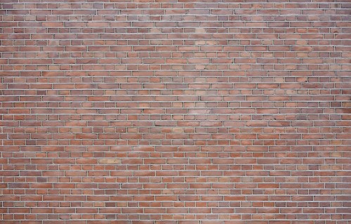 Image brown brick wall during daytime