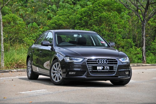 Image black audi a 4 on road during daytime