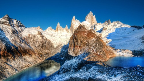 Image brown and white mountain range under blue sky during daytime