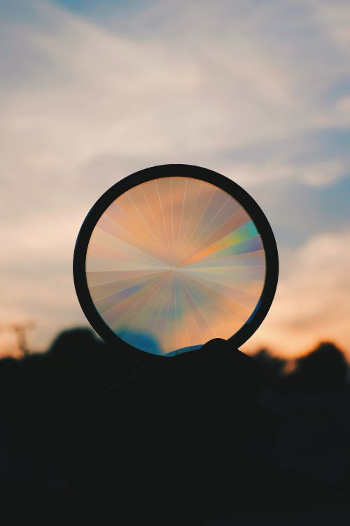Silhouette of Round Mirror With Sun Rays. Wallpaper in 3264x4896 Resolution