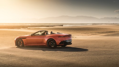 Image red chevrolet camaro on beach during daytime