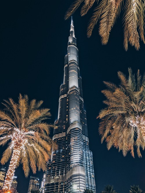 Image gray and black tower during night time