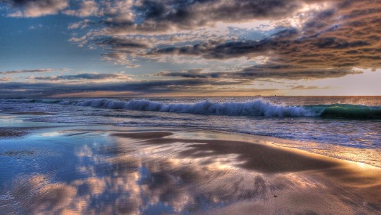 Image body of water under cloudy sky during daytime