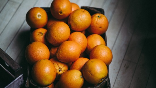 Image orange fruits on blue textile