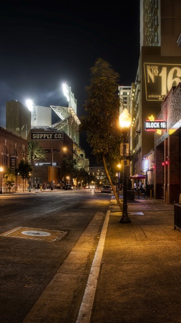 Image lighted street lights on the street during night time