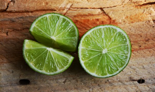 Image sliced lemon on brown brick wall