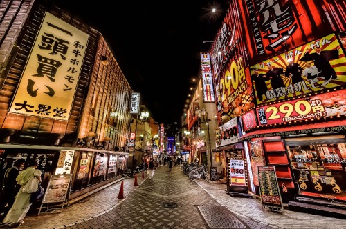 Image people walking on street during night time