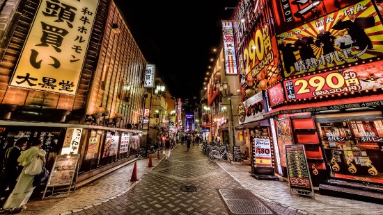 Image people walking on street during night time