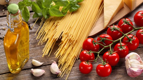 Image red tomato beside brown wooden stick