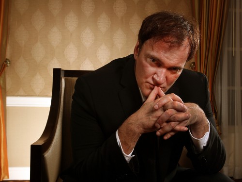 Image man in black suit sitting on white chair