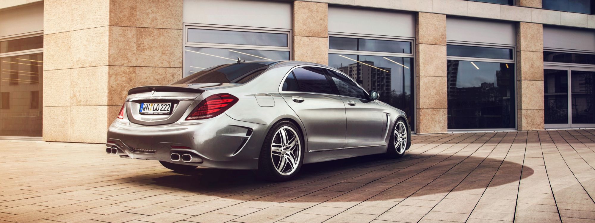 Silver Mercedes Benz Coupe Parked on Brown Brick Floor. Wallpaper in 3200x1200 Resolution
