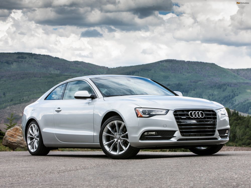 silver audi a 4 sedan on brown dirt road during daytime