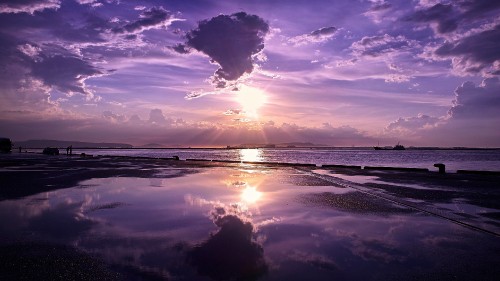 Image body of water under blue sky during sunset