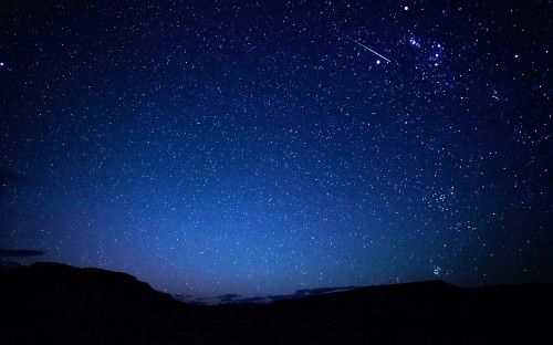 Image silhouette of mountain under blue sky during night time