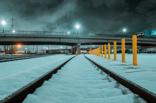 Image snow covered bridge during night time