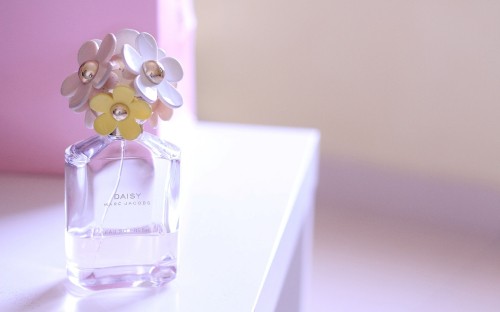 Image clear glass perfume bottle on white table