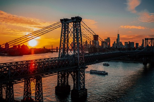 Image bridge over water during sunset