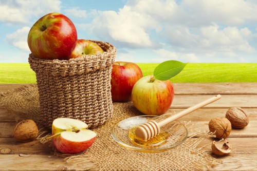 Image red apples on brown woven basket